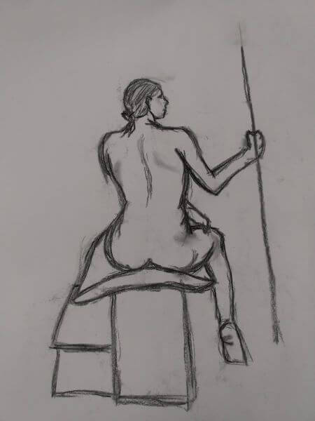 An observational life drawing in charcoal of a woman sitting holding a staff drawn from the back