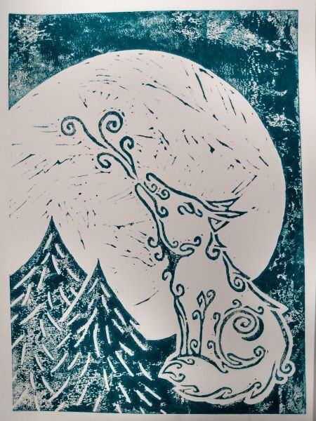 Lino print in green of a tribal patterned wolf howling to the moon in the forest