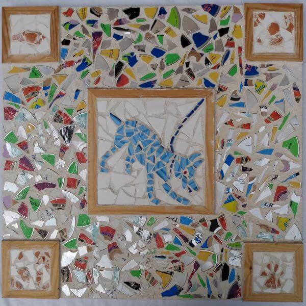 Dog themed mosaic board made from broken pottery and old computer disks