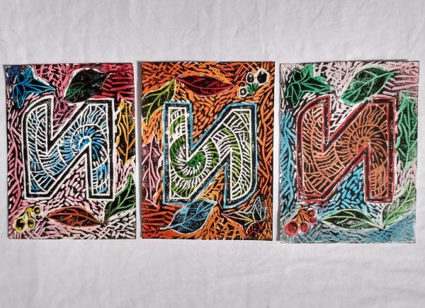 A trio of capital N letters with assorted elements of nature in the backgrounds
