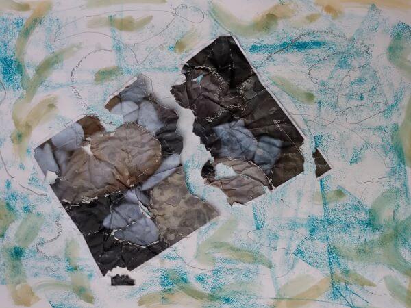 A collage using a torn and destructed rock picture