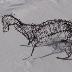 Sulpture of a dog made out of twisted wire